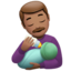 哺乳的男人: 中等肤色 — Apple