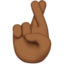 交叉的手指: 中等 深肤色 — Apple